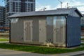 Electrical house with power lines. light box booth. place of work of an electrician. concrete house with insulation and air