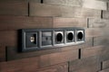 Electrical household switches and sockets close up. Minimalist interior design. Stylish bedroom and livingroom. Wooden Royalty Free Stock Photo