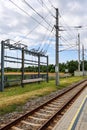 Electrical infrastructure powering railways under cloudy sky Royalty Free Stock Photo