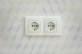 Electrical jack white plastic socket on a white wall Royalty Free Stock Photo