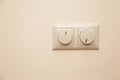 Electrical light dimmer switches on the wall