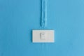 Electrical light switch on blue wall. Royalty Free Stock Photo