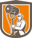 Electrical Lighting Technician With Spotlight Shield