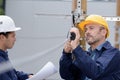 electrical line apprentice observing teachers demonstration Royalty Free Stock Photo