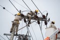 An electrical lineman working on a line