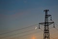 Electrical lines under a night sky with moon Royalty Free Stock Photo