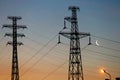 Electrical lines under a night sky with moon Royalty Free Stock Photo