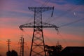 Electrical lines under a night sky with moon Royalty Free Stock Photo