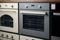 Electrical ovens, home appliances in the store.. Royalty Free Stock Photo