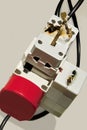 Electrical overload. Burned adapter, plugs. Royalty Free Stock Photo