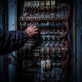 Electrical Panel Repair, Electrician Switching off Circuit Breakers in Fuse Box, Hands Closeup Royalty Free Stock Photo