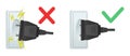 Electrical plug connected to outlet. Correct and incorrect connection of device to mains. Short circuit danger. Socket with Royalty Free Stock Photo