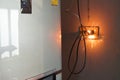 electrical plug sparking and burning Caused by a short circuit, concept, danger from using non-standard equipment, defective