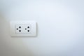 Electrical plugs on the white wall Royalty Free Stock Photo