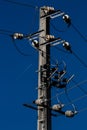 Electrical post with power line cables against a dark blue sky, Braga. Royalty Free Stock Photo