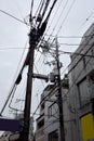 Electrical power line cables and transformers above earth n Japan, Asia Royalty Free Stock Photo