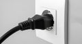Electrical Power Plug Connected to Wall Socket Royalty Free Stock Photo