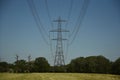 Electrical pylon and cables against a blue sky Royalty Free Stock Photo