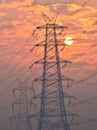 Electrical pylon and high voltage power lines near transformation station at Sunrise in Gurgaon Royalty Free Stock Photo