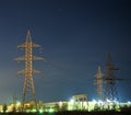 Electrical pylon and high voltage power lines at night. Royalty Free Stock Photo