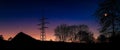 Electrical pylon with wire at sunset