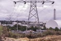 Electrical pylons with Oil and gas industry - Petrochemical factory, Industrial zone and petrochemical plant forest foreground