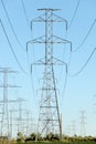 Large electrical pylons holding high voltage electrical wires.