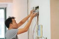 Electrical renovation work, Man install Industrial electrical equipment Royalty Free Stock Photo