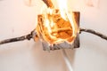 Electrical short circuit. Cable wiring is on fire, splitter is self-igniting Royalty Free Stock Photo
