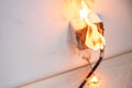 Electrical short circuit. Wiring cable burn on fire flame