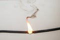 Electrical short circuit. Wiring cable on fire flame Royalty Free Stock Photo