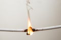 Electrical short circuit. Wiring cable on fire flame Royalty Free Stock Photo