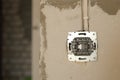 Electrical socket hole on concrete wall. Under construction electrical socket Royalty Free Stock Photo