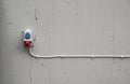 Electrical socket mounted on concrete wall.. Royalty Free Stock Photo