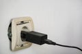 Electrical socket outlet falling out of wall Royalty Free Stock Photo