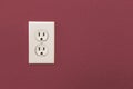 Electrical Sockets In Colorful Burgundy Wall