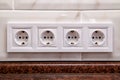 Electrical sockets on a kitchen tile wall Royalty Free Stock Photo