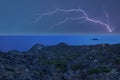 An electrical storm over the sea at sunset Royalty Free Stock Photo