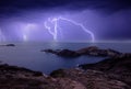 An electrical storm over the sea at sunset Royalty Free Stock Photo