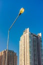 Electrical streetlamp with high rise modern building background