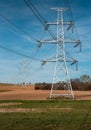 Electrical substation utility pole, state and high voltage power line silhouette with blue cloudy sky at sunset. View of Royalty Free Stock Photo