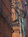 Electrical supply in an abandoned factory against brick wall