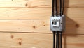 Electrical switch box with multiple cables connected to wooden wall connection Royalty Free Stock Photo