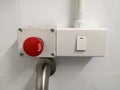 Electrical switch , lighting switch and Emergency switch on concrete wall Royalty Free Stock Photo