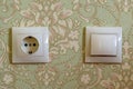 Electrical switch and plug on wall Royalty Free Stock Photo