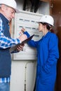 electrical team checking fuse box