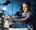 Electrical technicians working on electronics parts Royalty Free Stock Photo