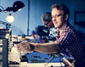 Electrical technicians working on electronics parts Royalty Free Stock Photo