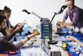 Electrical technicians working on robot electronics parts