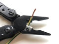 Electrical tools, pliers cut the yellow and green cable Royalty Free Stock Photo